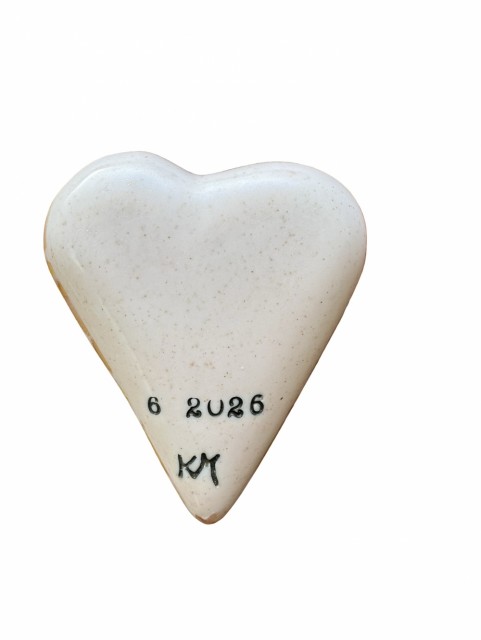 Bakside: tydelig lys rosa farge med gull glitter i